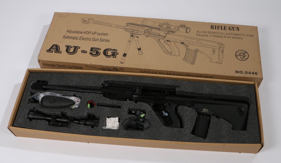 AU-5G Airsoft Electric Rifle in black, battery operated, vendor states in working condition,
