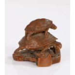 Japanese Edo period wood Netsuke, carved as three turtles stacked with heads leaning to one side,