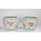 Pair of Chinese famille rose porcelain planters, of fish bowl form, late Qing Dynasty, with a rolled