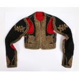 Greek metal threat waistcoat, with large flower heads and trailing leaf and vine decoration to the
