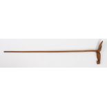 Austral Islands hardwood prestige stick, the handle carved as a stylised a bird, 85cm long