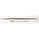 Papua New Guinea Massim bow and arrow, the bow with six graduated ridges and tapering ends, the