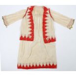 Greek dress and shirt, in red and cream with an upper section in silk adjourned with gilt metal