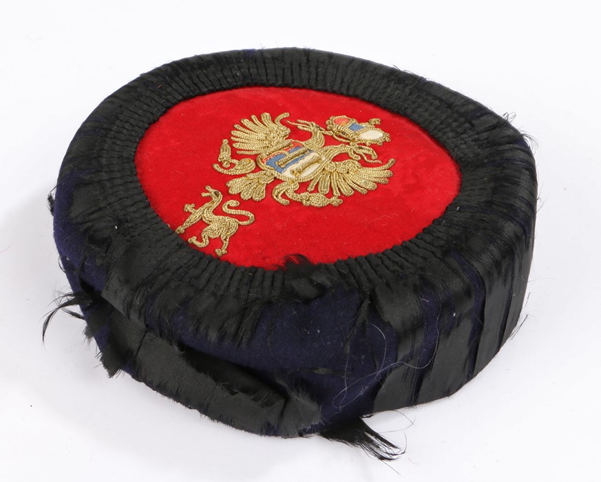 Montenegrin kapa (cap), initials of king Nikola I of Montenegro the the chest of a double headed