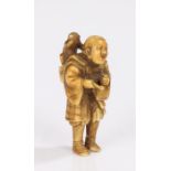 Japanese Edo period ivory netsuke, appears to be signed Tomotada, Kyoto school, carved as a standing