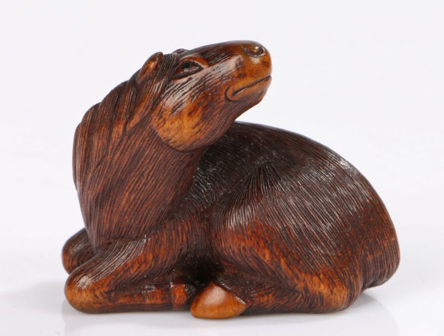 Japanese wood Netsuke of a horse, by Sari, Iwashiro Province, 19th century, signed in an oval to the