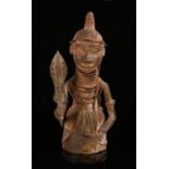 Benin bronze figure, Nigeria, 20th Century, of a warrior holding a sword and his left arm