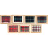 Collection of seven Scottish 19th Century framed tartan samples, each with a pen written title, to