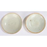 Two Chinese Qingbai ware shallow dishes, Song Dynasty (960-1279) pale cream glaze with unglazed