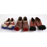 Three pairs of Greek Opanke Tsarouhi Pom-Pom shoes, the first pair with red pom-poms and deep red
