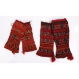 Two pairs of Greek woollen puttees, in deep red and pale red with geometric line design, Provenance;