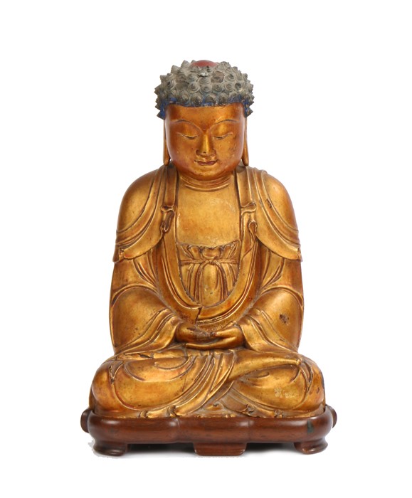 Chinese gilt lacquered wood figure of Buddha, Ming Dynasty, the pointed hair whorls framing a red