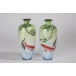 Pair of Japanese enamel vases, each with a Koi Carp in a river with branches above, marks to