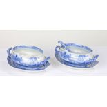 Two Spode blue and white sauce tureens and stands, together with a ladle, transfer decorated with
