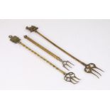 Three early 20th Century brass toasting forks, including a telescopic example, 62cm fully