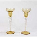 Pair of early 20th Century flute glasses, with bulbous bowls above air twist stems, 21cm high (2)