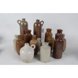 Collection of stoneware bottles and jugs, of varying sizes and styles, some marked Campos Filhos