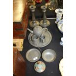 Quantity of pewter, to include a pair of candlesticks, spot hammered tea set, various small bowls