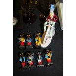 Seven Robertson Golly figures of band members, and an Italian pottery figure of a gentleman riding a