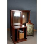 20th Century mahogany bookcase, having a pair of glazed doors enclosing adjustable shelves, 112.