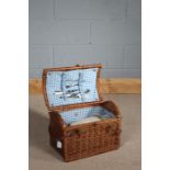 Wicker picnic basket, with plates and cutlery