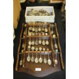 Two souvenir spoon racks containing a collection of spoons, plated flatware (qty)