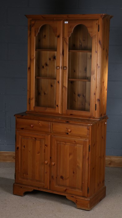 Pine bookcase cabinet, the cabinet with glazed doors enclosing two shelves, above the base with