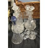 Four cut glass decanters together with a glass vase and some decanter stoppers (Qty)