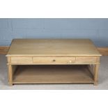 Light oak coffee table, the rectangular top above a frieze drawer, raised on square legs united by X