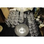 Collection of mostly cut table glassware, to include three decanters, wine glasses, tumblers and