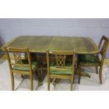 Walnut veneered extending dining table, the D shaped ends with reeded frieze, raised on two turned