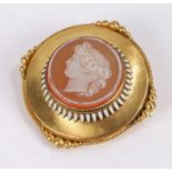 Neoclassical gold brooch, with central cameo depicting a classical female bust in profile,