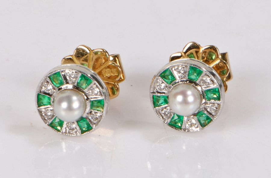 18 carat gold pearl, emerald and diamond, the circular head with a central pearl and surround of