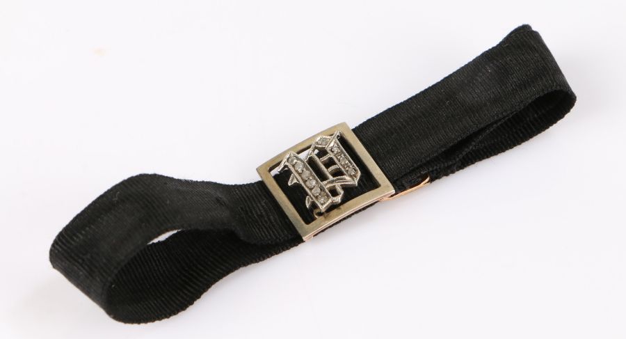 9 carat gold and diamond bracelet, the black fabric bracelet with gold clasp and diamond set panel