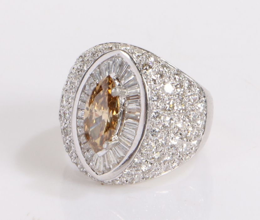 Diamond set ring, the central cinnamon coloured diamond at an approximate weight of 1.21 carats