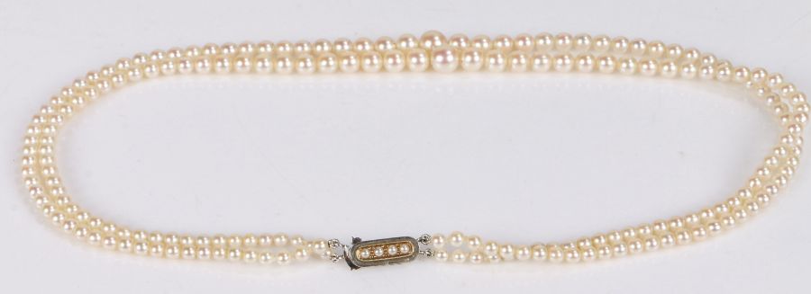 Two strand graduated pearl necklace, with 9 carat white gold clasp, 27g