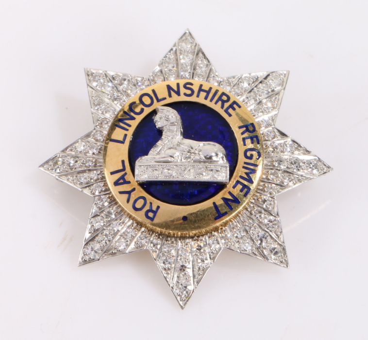 Royal Lincolnshire Regiment gold, diamond and blue enamel sweetheart brooch, of star form, the