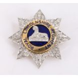 Royal Lincolnshire Regiment gold, diamond and blue enamel sweetheart brooch, of star form, the