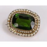 Pearl set brooch, with a central facetted green stone, 27mm diameter