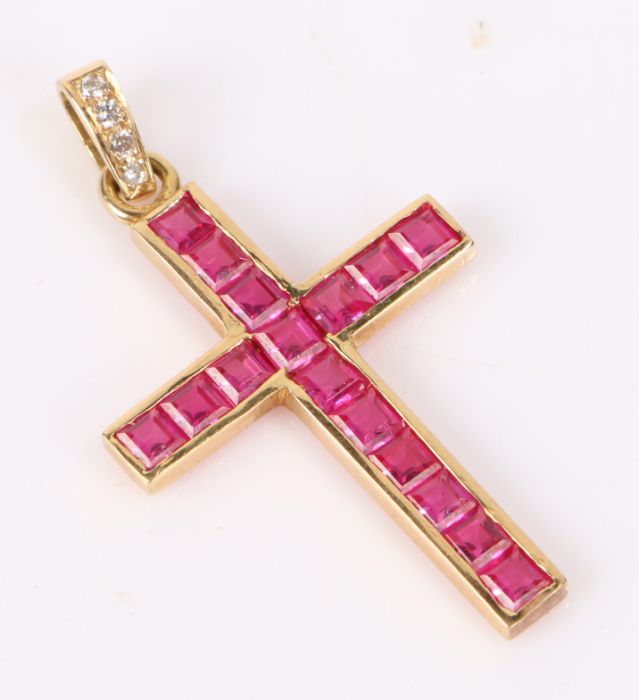 Gold ruby and diamond set cross pendant, the cross set with seventeen square cut rubies, with four