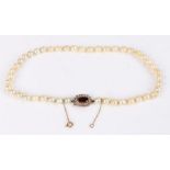 Pearl necklace, with garnet and pearl set clasp, 43cm long, 29.6g