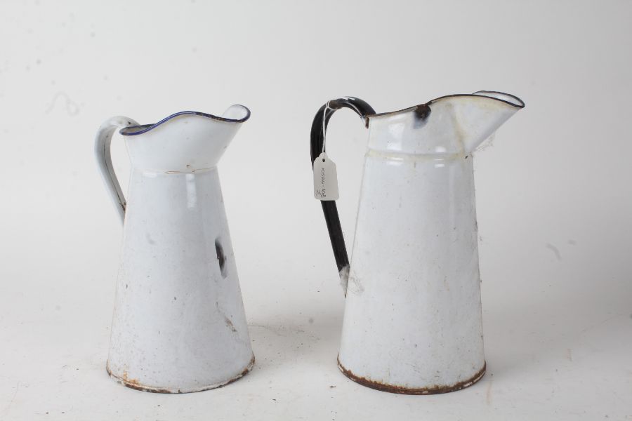 Two white enamel jugs, the tallest 27cm (2)