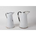 Two white enamel jugs, the tallest 27cm (2)
