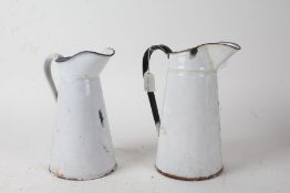 Two white enamel jugs, the tallest 27cm (2)