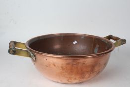 20th century copper and wooden handled dairy pot, 39.5cm diameter