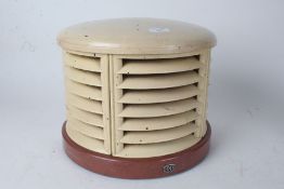 HMV Art Deco heater, of part rounded vented form, centred with a light bulb - sold as collectors