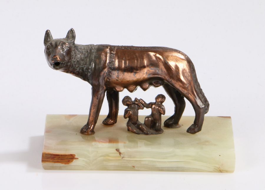 Romulus and Remus, bronzed figure group modelled suckling from a wolf, raised on an onyx rectangular