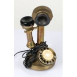 Brass candlestick telephone, with rotary dial, 31cm high