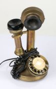 Brass candlestick telephone, with rotary dial, 31cm high