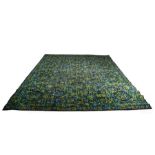 20th Century Axminster rug, in blue and green with abstract motifs, label to reverse, 354cm x 273cm
